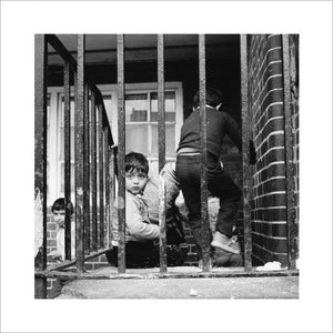 Children play outside their homes near Brick Lane: 1983