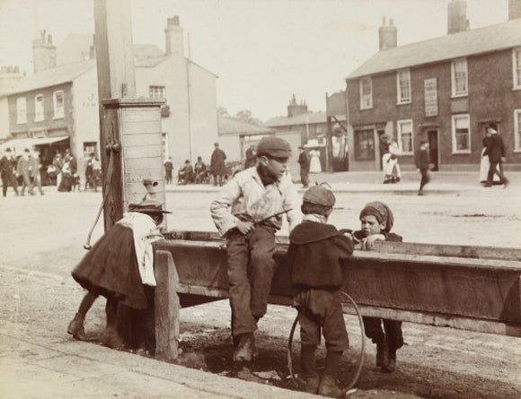 Children Children playing at a water trough in Barnet High Street, c.1900