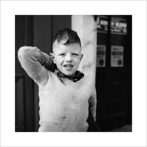 Portrait of a young boy in an Islington street; 1956