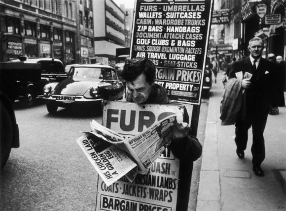 Man wearing a sandwich board: 1961