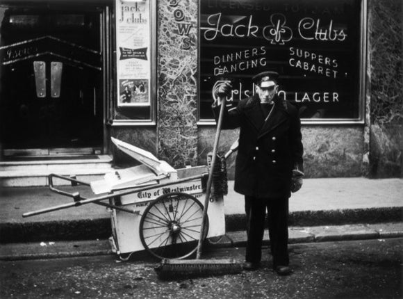 A street cleaner outside the Jack of Clubs nightclub: 1961