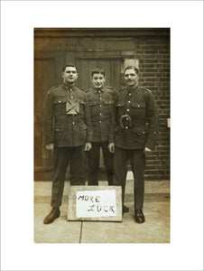 Three soldiers stand with a message of Hope; c.1914